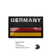 Black reflective patch featuring horizontal stripes of pink, red, and yellow.