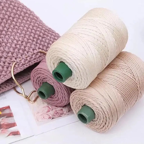 Spools of beige and mauve 3mm ice rope crochet yarn for crafting