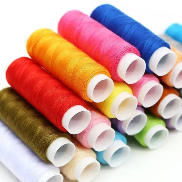 Rolls of brightly colored thread in various shades including pink, orange, yellow, and blue for sewing and embroidery