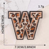 Iron-on patch of the letter W in leopard print fabric on a white background.