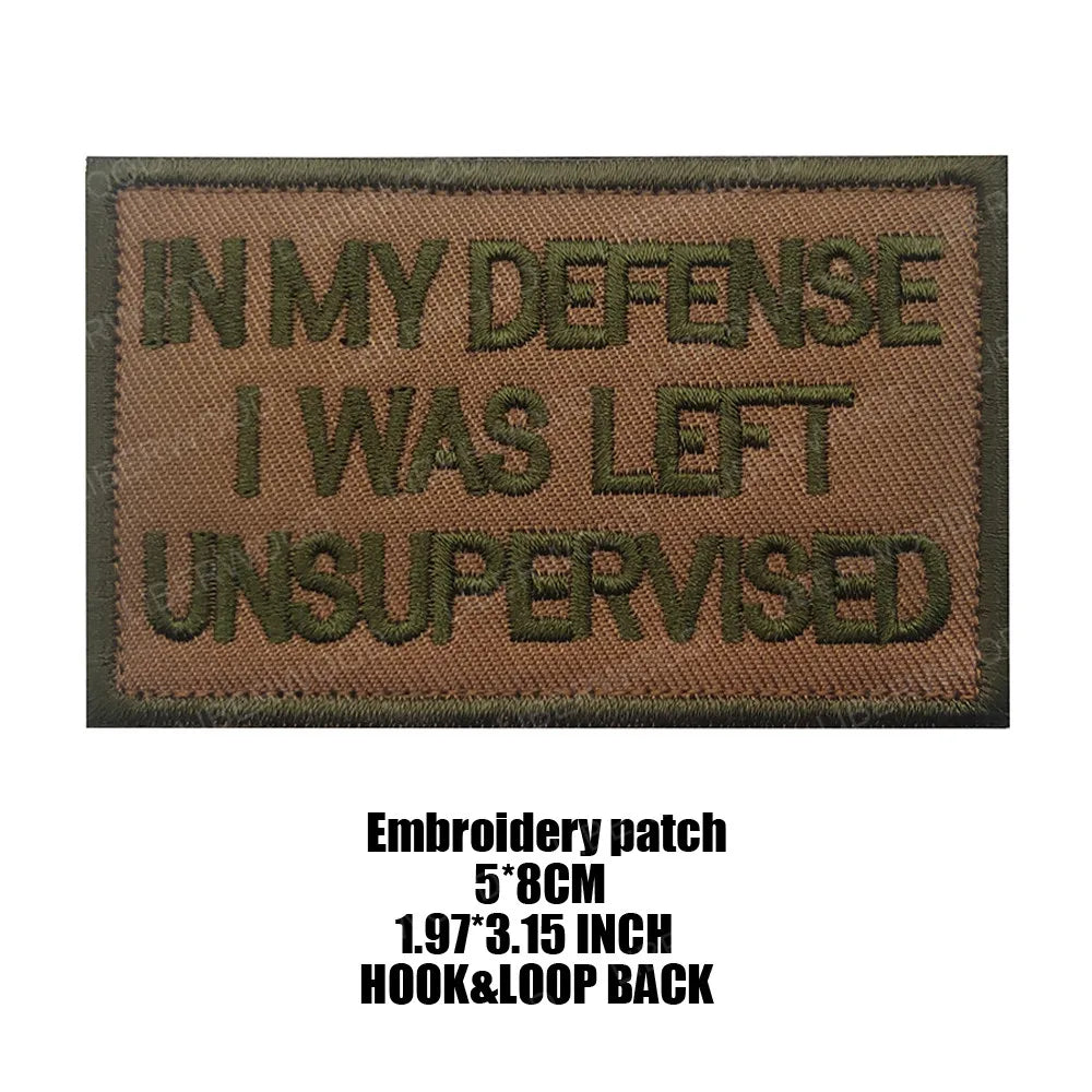 Dark olive embroidered patch with text IN MY DEFENSE I WAS LEFT UNSUPERVISED