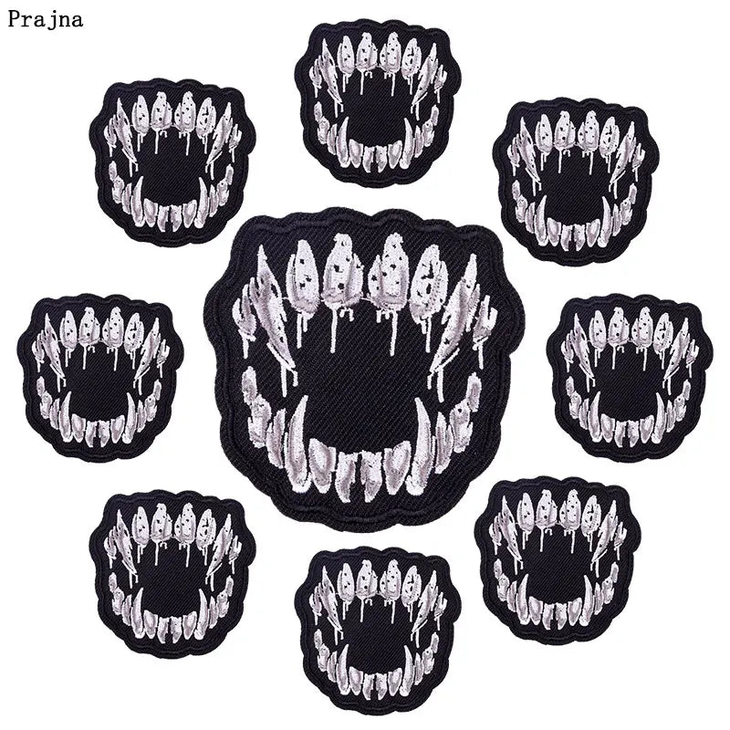 A collection of black and white DIY punk embroidery patches for clothing