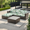A modern outdoor sofa set featuring light green and white floral patterned cushions on a gray wicker frame.