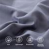 Close-up of a gray microfiber fabric showing texture and folds, highlighting soft, lightweight, breathable, and machine washa