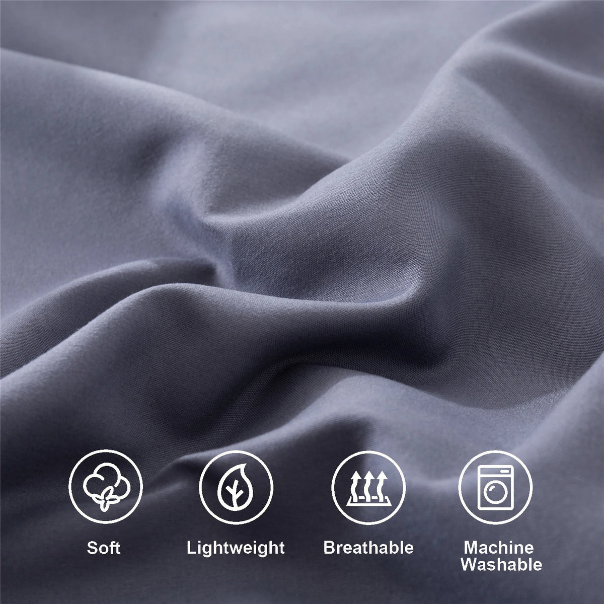 Close-up of a gray microfiber fabric showing texture and folds, highlighting soft, lightweight, breathable, and machine washa