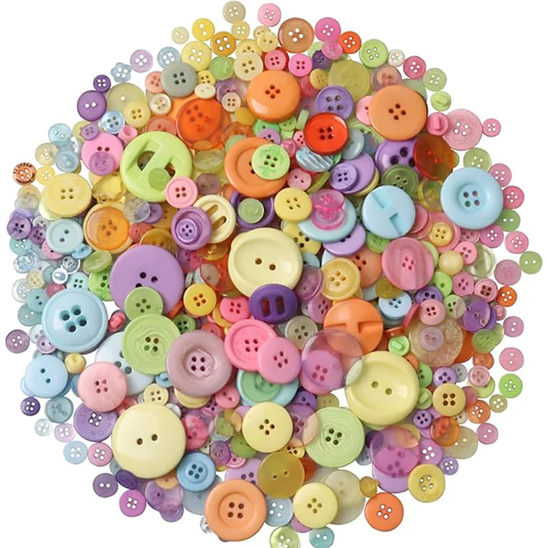 A large pile of assorted resin sewing buttons in various colors including pink, yellow, green, and orange.