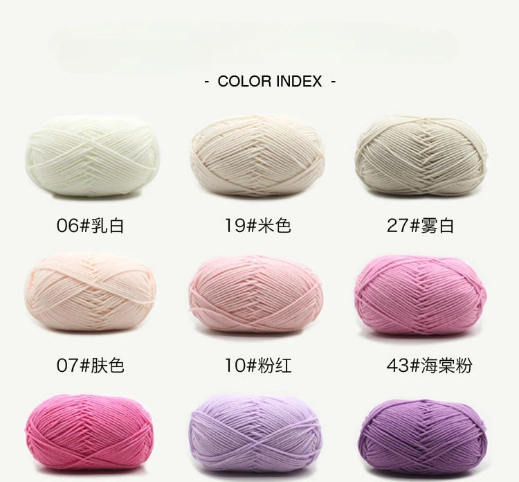 A collection of pink and white organic cotton knitting yarn skeins shown in various colors and textures.