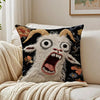 A black pillow featuring a white goat with wide eyes and an open mouth screaming expression