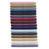 A stack of soft brushed microfiber pillow covers in various muted and deep colors.