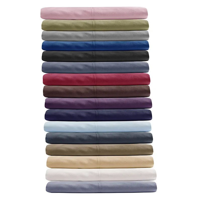 A stack of soft brushed microfiber pillow covers in various muted and deep colors.