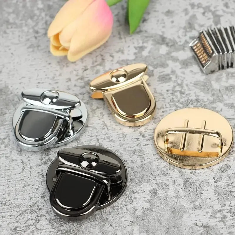 A collection of gold and silver metal twist locks for bags, cases, and DIY projects.
