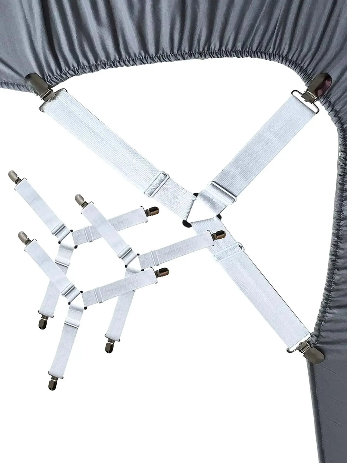 Four silver adjustable bed sheet holder clips are shown attached to a gray fabric, used for securing bedding.