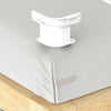 White invisible bedsheet corner tightener clips placed on a light gray sheet.