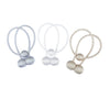 Three sets of silver and beige magnetic curtain tiebacks with looped threads