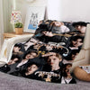A fleece throw blanket featuring a collage of Stray Kids Kpop members in various poses and outfits.