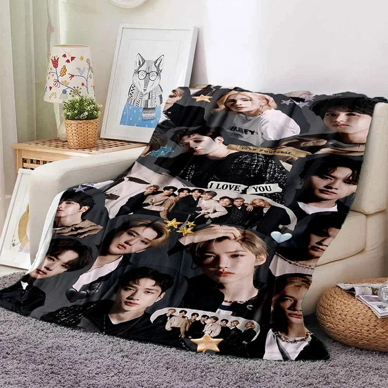 A fleece throw blanket featuring a collage of Stray Kids Kpop members in various poses and outfits.