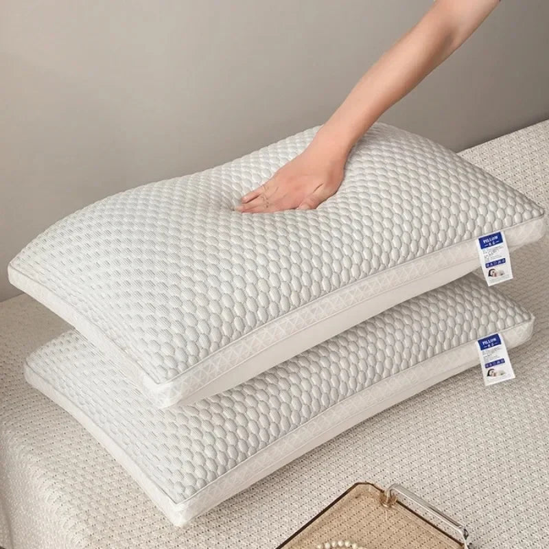 A white 3D cooling therapy pillow is shown stacked on a surface with a hand resting on the top pillow.