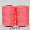 Two spools of bright coral pink hand knitting and crochet cord for crafting