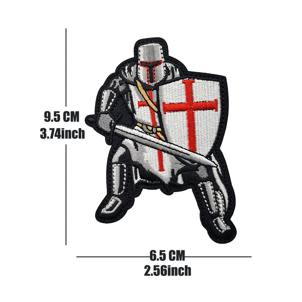 Embroidered military cross shield hook and loop patches featuring a silver cross on a black background