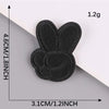 A black embroidered leather patch shaped like a bee, measuring 4.6cm by 3.1cm.