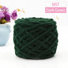 A ball of dark green chunky velvet knitting yarn labeled N57 Dark Green.