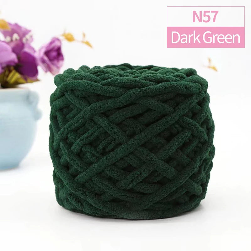 A ball of dark green chunky velvet knitting yarn labeled N57 Dark Green.