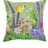 A fabric throw pillow featuring a watercolor illustration of various purple, pink, and yellow wildflowers and a butterfly.