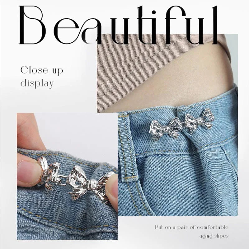 Close up display of silver adjustable waist clip brooches used to decorate denim fabric.