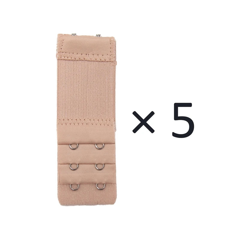 A set of five beige adjustable bra extender straps with metal clasps.