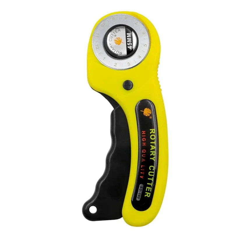 Yellow rotary cutter kit with a circular blade guide and a handle.