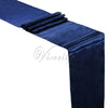 A dark blue luxury satin table runner draped and folded for events.