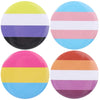 A set of seven colorful rainbow striped tinplate pins featuring various colors and patterns.