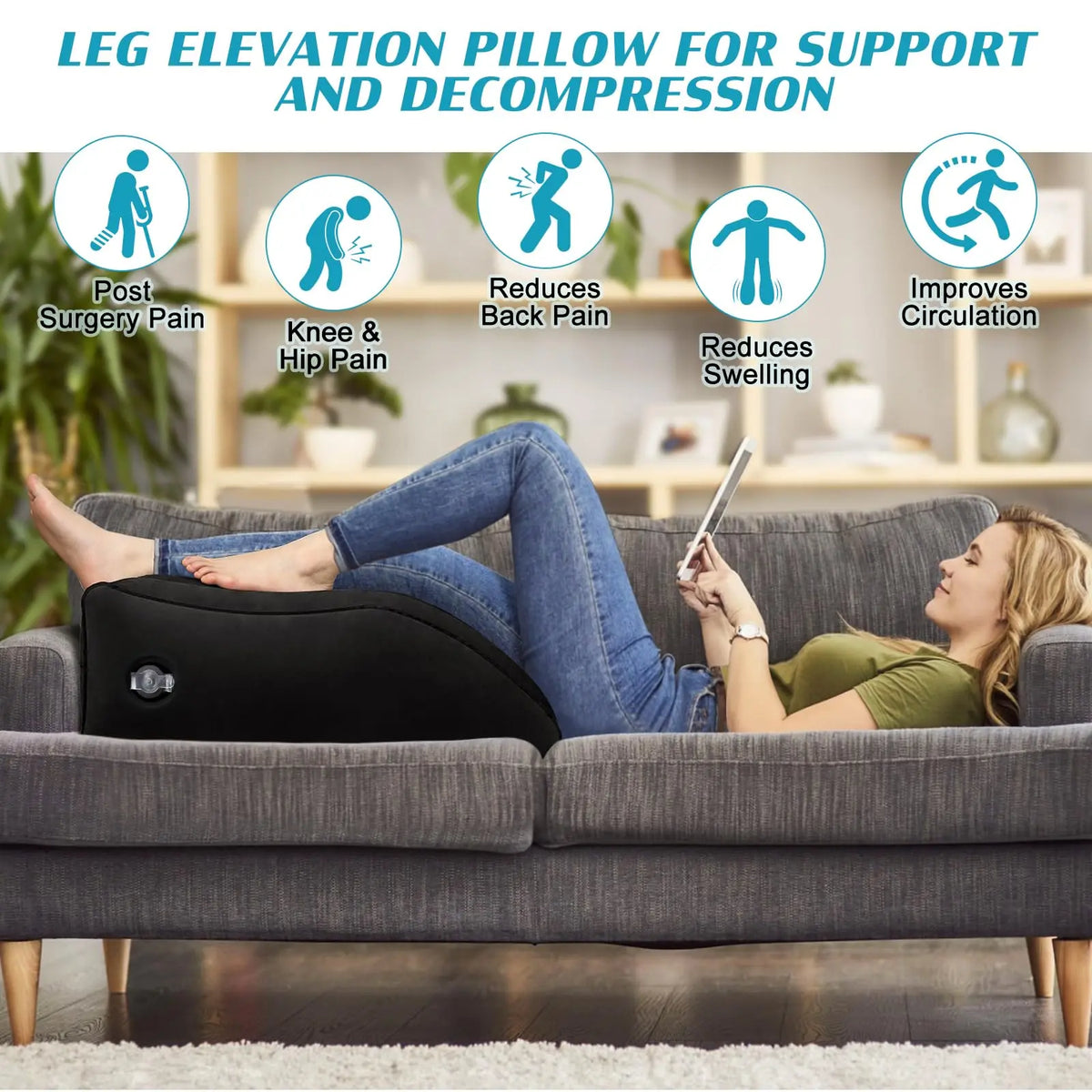 A woman is lying on a couch using a black inflatable leg elevation pillow for pain relief and decompression.