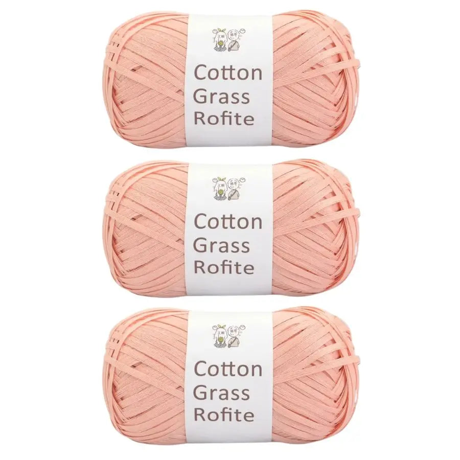 Three skeins of pink cotton grass roving yarn labeled Cotton Grass Rofite