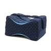 A dark blue memory foam knee pillow designed for side sleepers with adjustable straps.