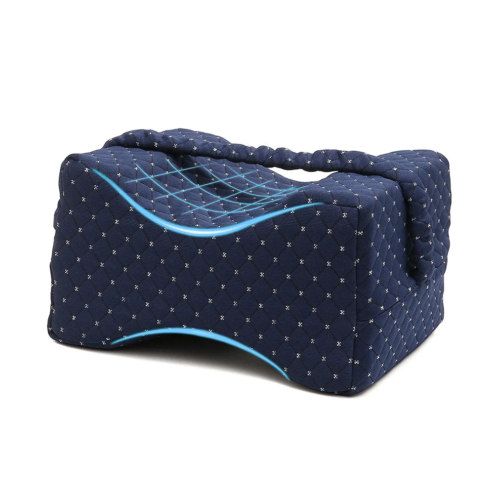 A dark blue memory foam knee pillow designed for side sleepers with adjustable straps.