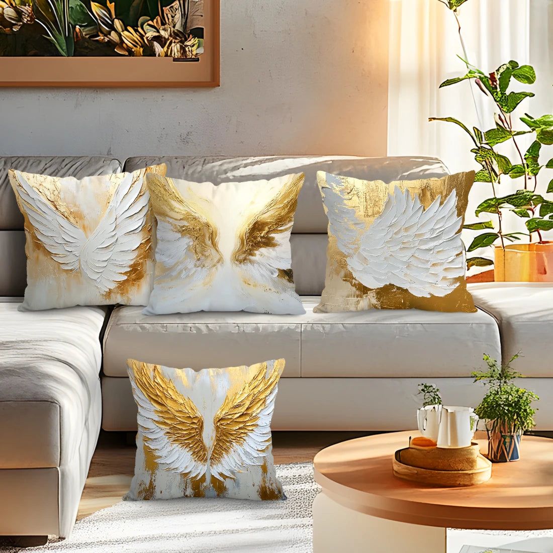 Decorative throw pillow covers featuring golden and white wing patterns on a neutral sofa.