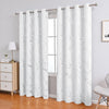 White curtain fabric with gray marble print hanging from a rod