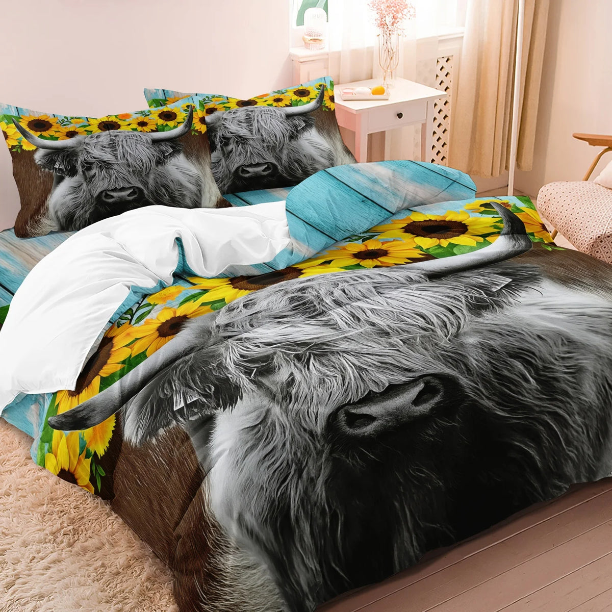 A bedding set featuring a print of Highland cows on pillows and a duvet cover.