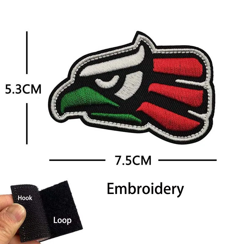 Tactical patch featuring an eagle head design with red, green, and white colors.