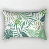 A decorative pillowcase featuring a tropical leaf print in shades of green and white.