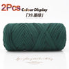 A spool of dark green reusable elastic yarn used for crafting.