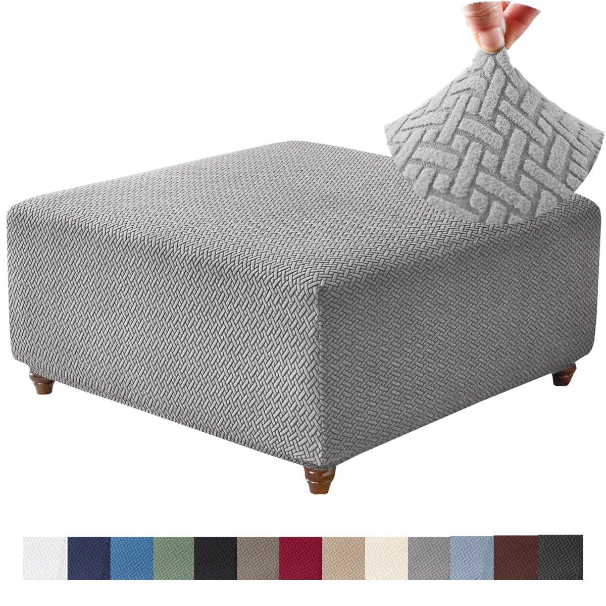 Gray stretch jacquard ottoman cover with a textured pattern and a matching fabric swatch strip.