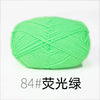 A ball of bright lime green organic cotton 4ply knitting yarn.