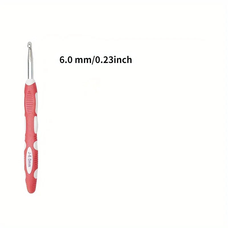 A pink ergonomic crochet hook and needle set with a 6.0 mm / 0.23 inch size.