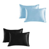 A set of two satin silk pillowcases, one light blue and one black.