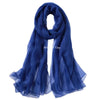 A deep blue sheer scarf draped elegantly.