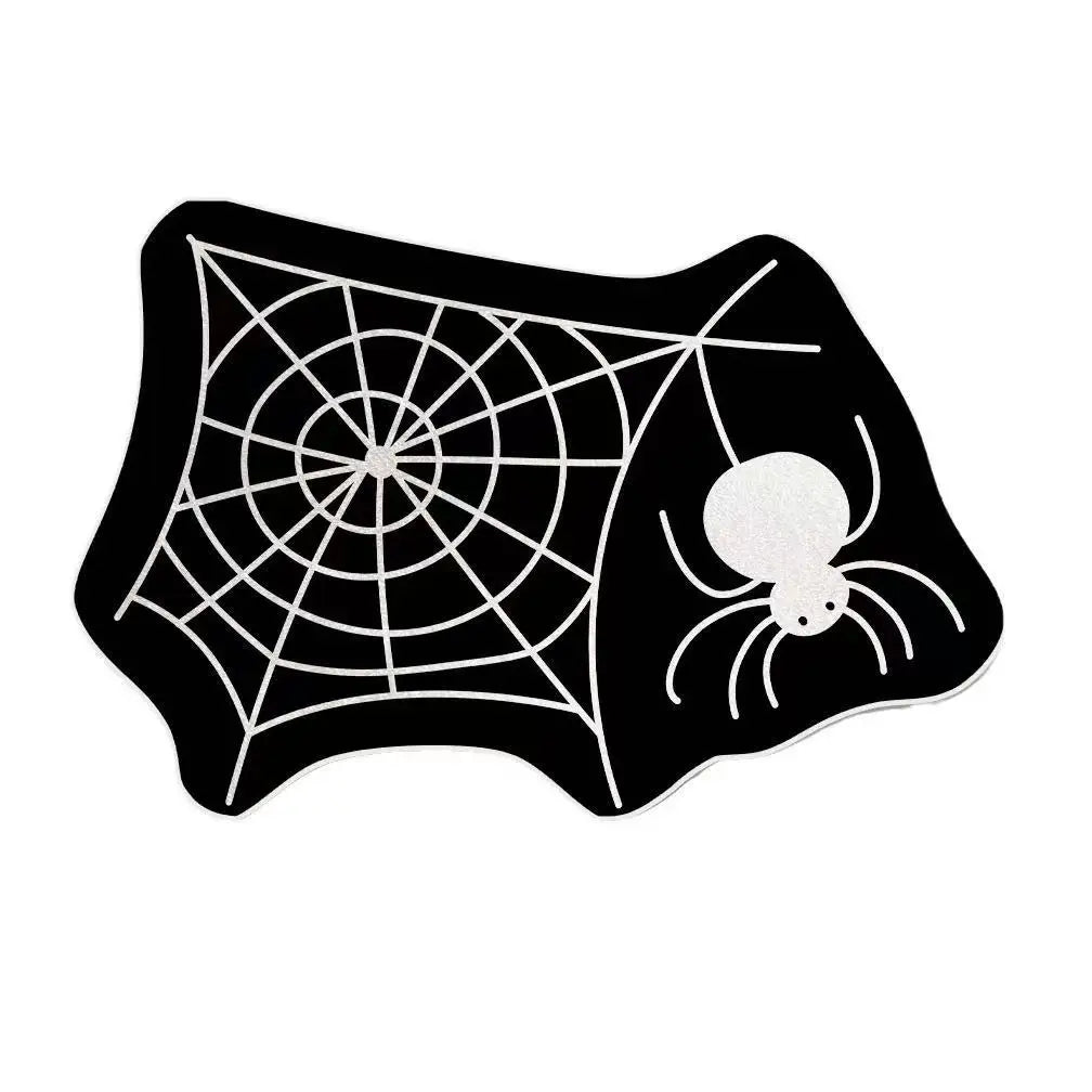 Black decorative non-slip mat featuring a white spiderweb design.