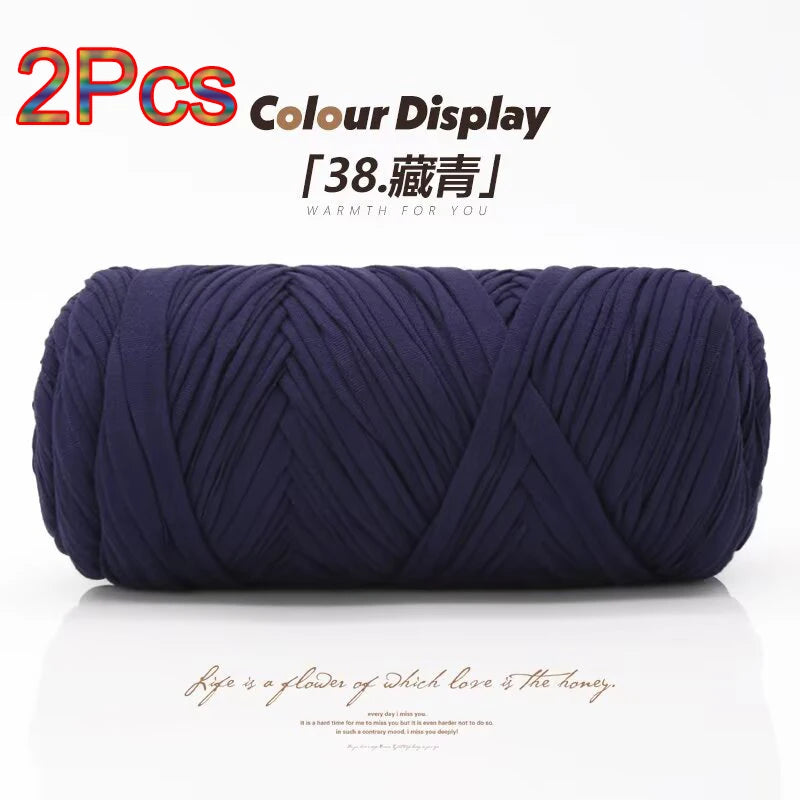 A skein of dark navy blue elastic yarn is displayed, ready for crafting.