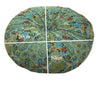 A round cushion covered in blue and green bohemian cotton linen fabric with a white cross dividing the surface.